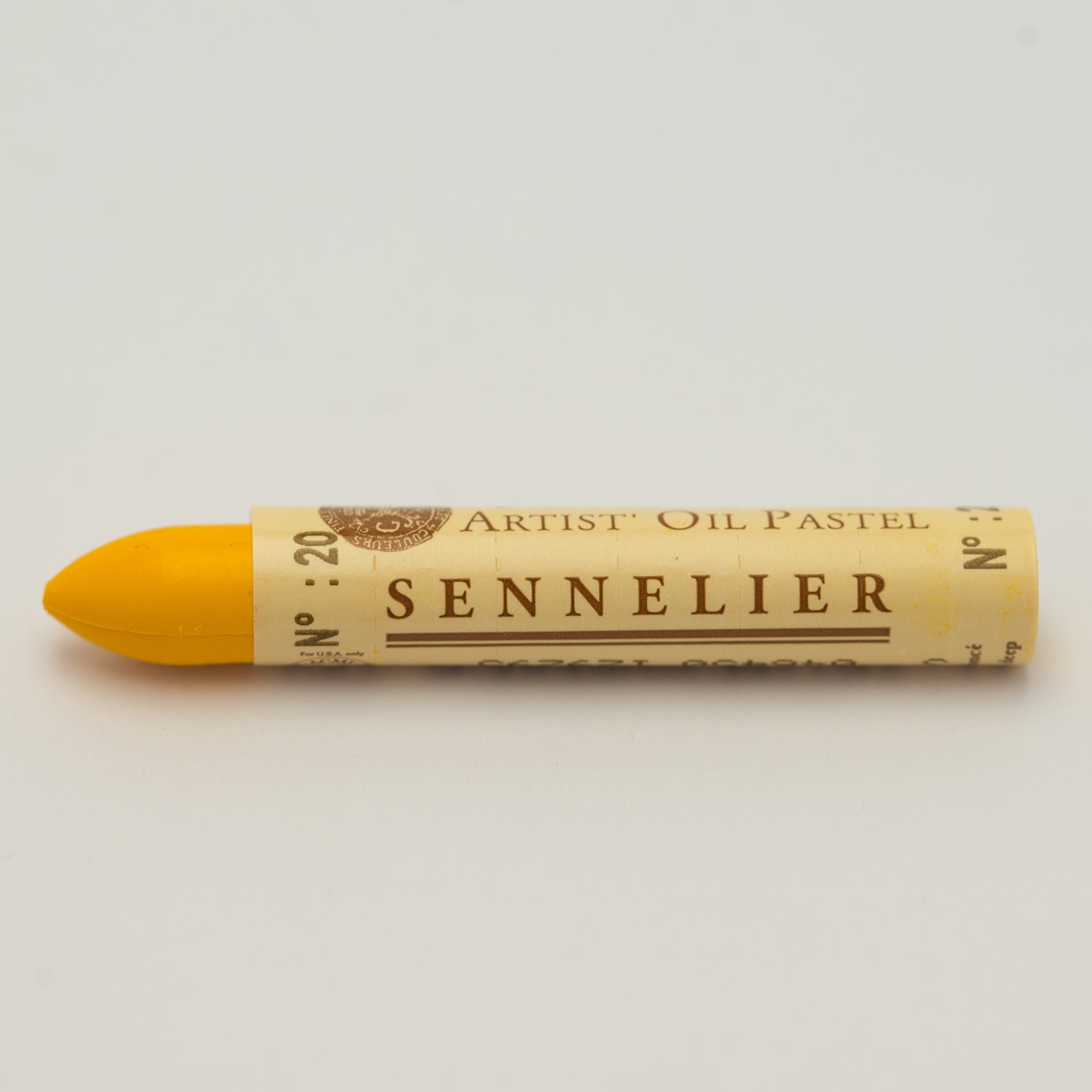 A single Sennelier oil pastel crayon against a white background, displaying the brand name and the words 'Artist Oil Pastel' on the wrapper.
