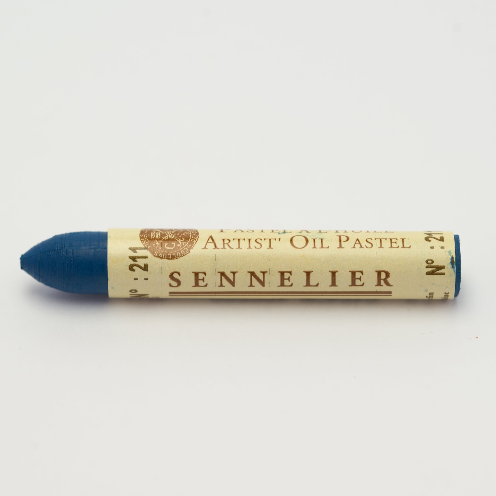 A single Sennelier oil pastel crayon against a white background, displaying the brand name and the words 'Artist Oil Pastel' on the wrapper.