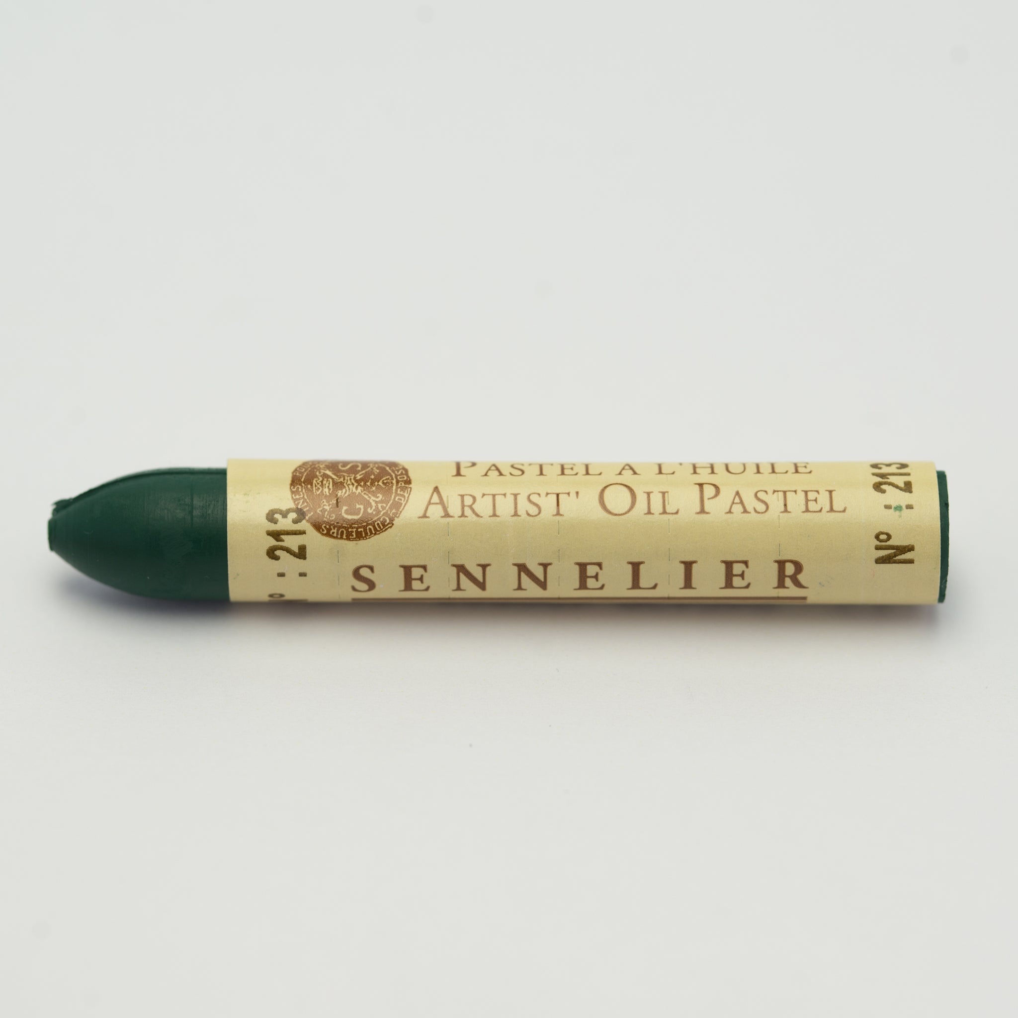 A single Sennelier oil pastel crayon against a white background, displaying the brand name and the words 'Artist Oil Pastel' on the wrapper.