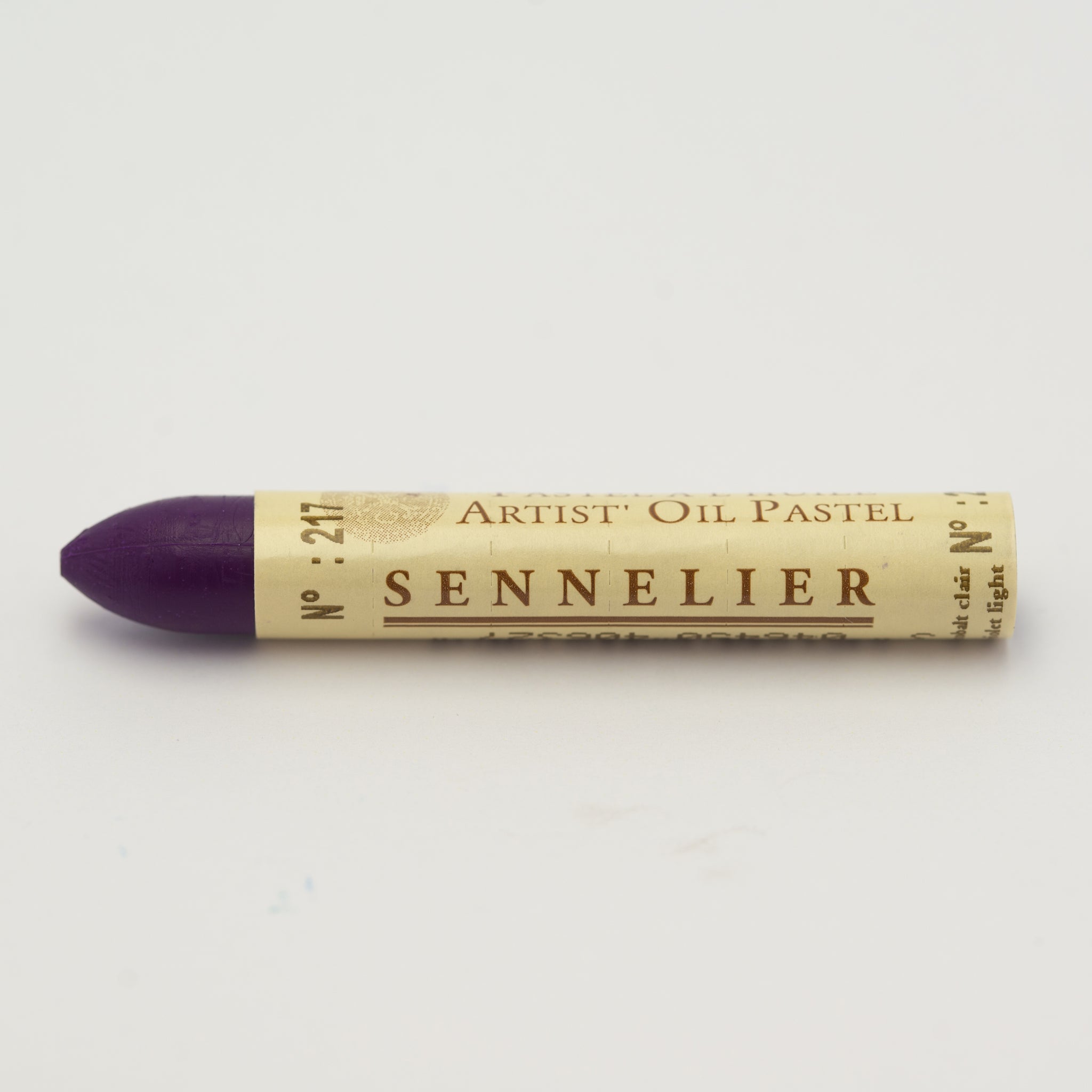 A single Sennelier oil pastel crayon against a white background, displaying the brand name and the words 'Artist Oil Pastel' on the wrapper.
