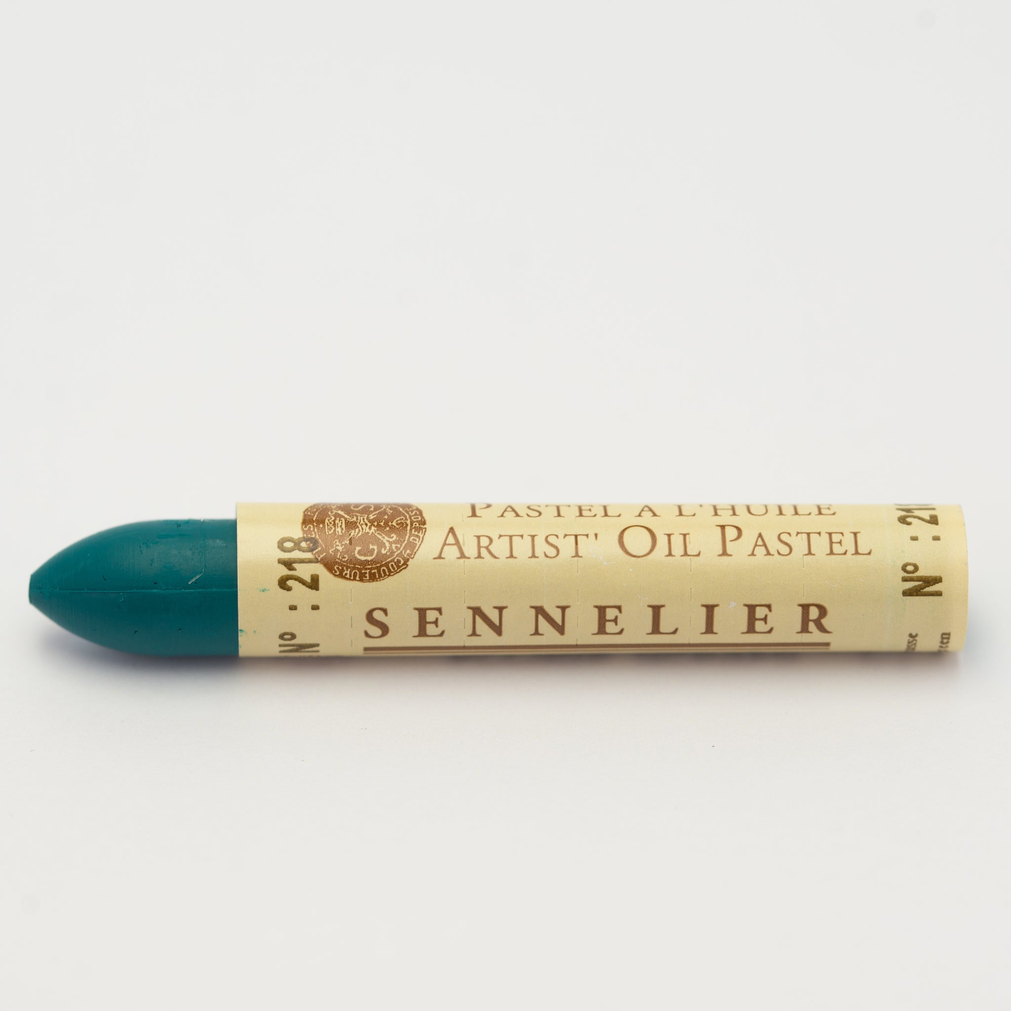 A single Sennelier oil pastel crayon against a white background, displaying the brand name and the words 'Artist Oil Pastel' on the wrapper.