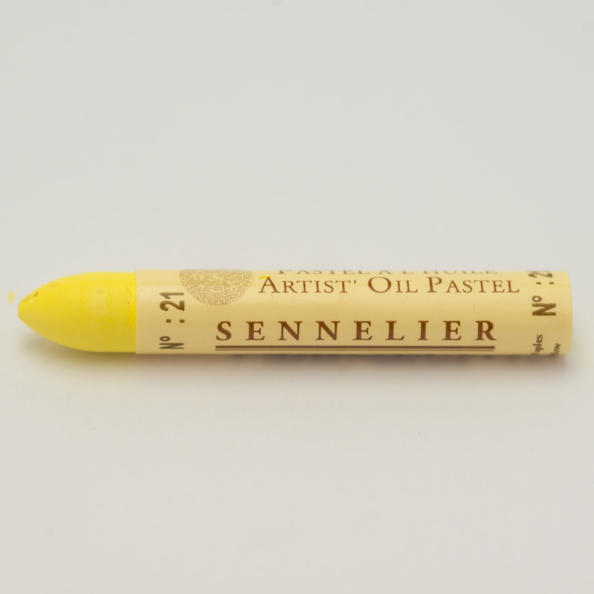 A single Sennelier oil pastel crayon against a white background, displaying the brand name and the words 'Artist Oil Pastel' on the wrapper.