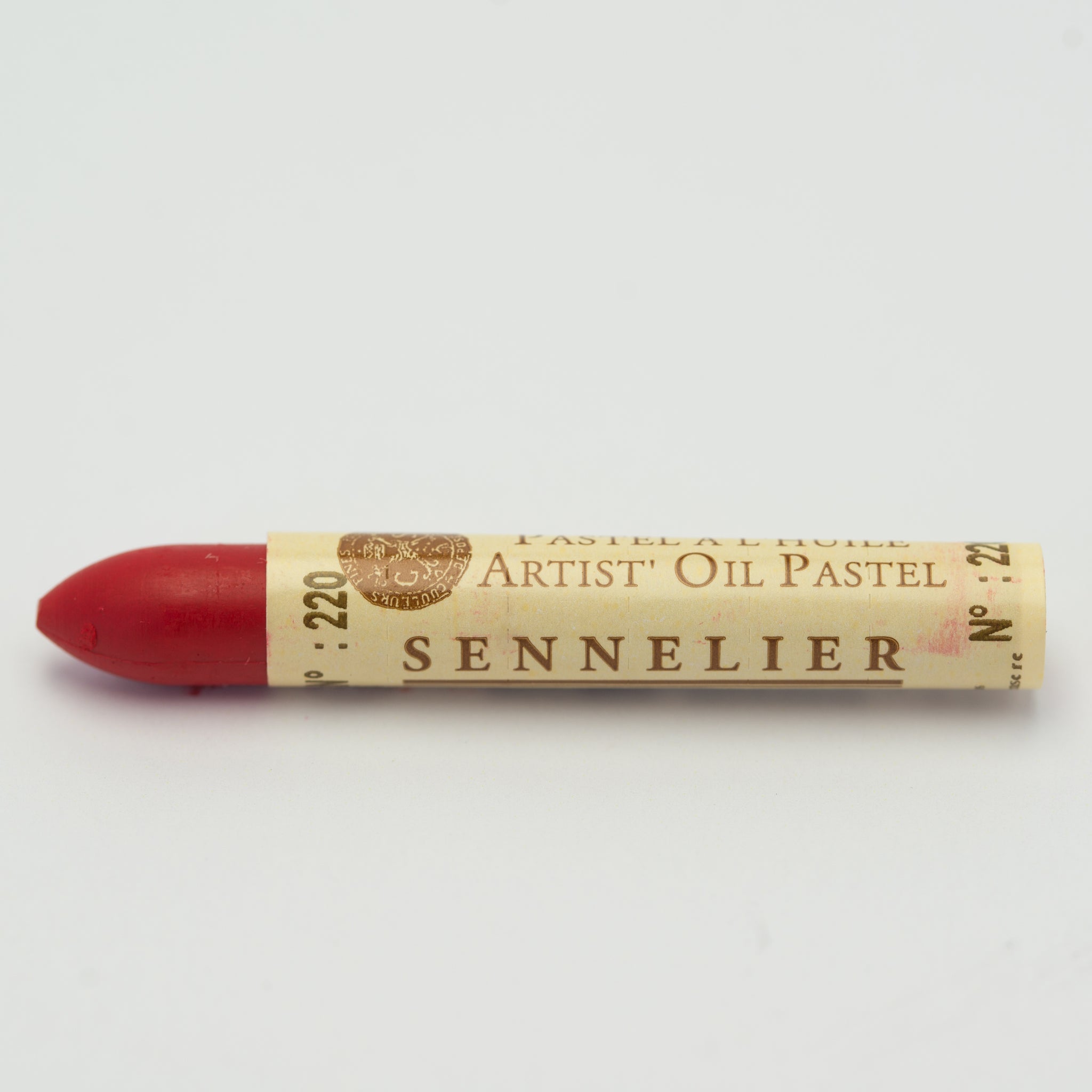 A single Sennelier oil pastel crayon against a white background, displaying the brand name and the words 'Artist Oil Pastel' on the wrapper.