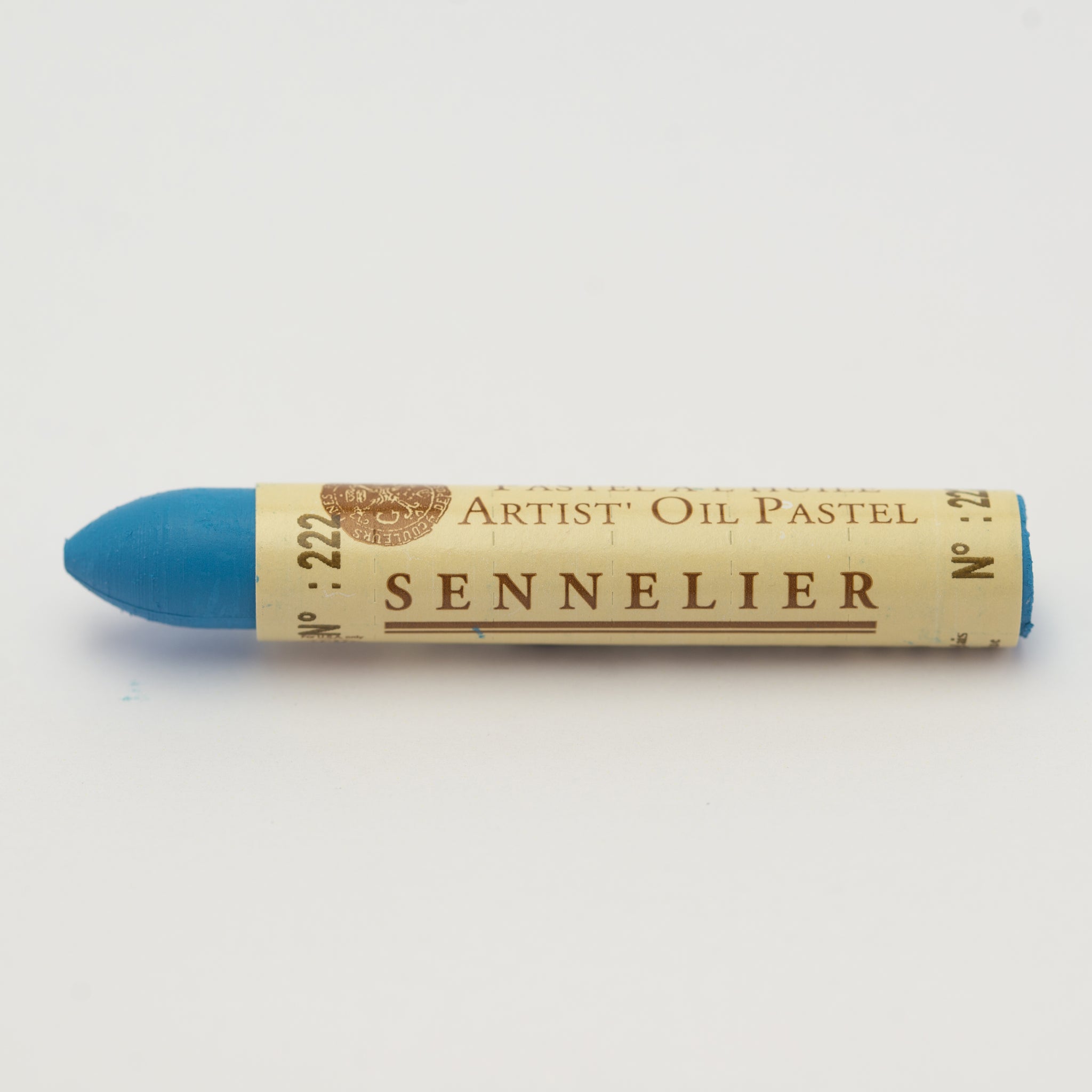 A single Sennelier oil pastel crayon against a white background, displaying the brand name and the words 'Artist Oil Pastel' on the wrapper.