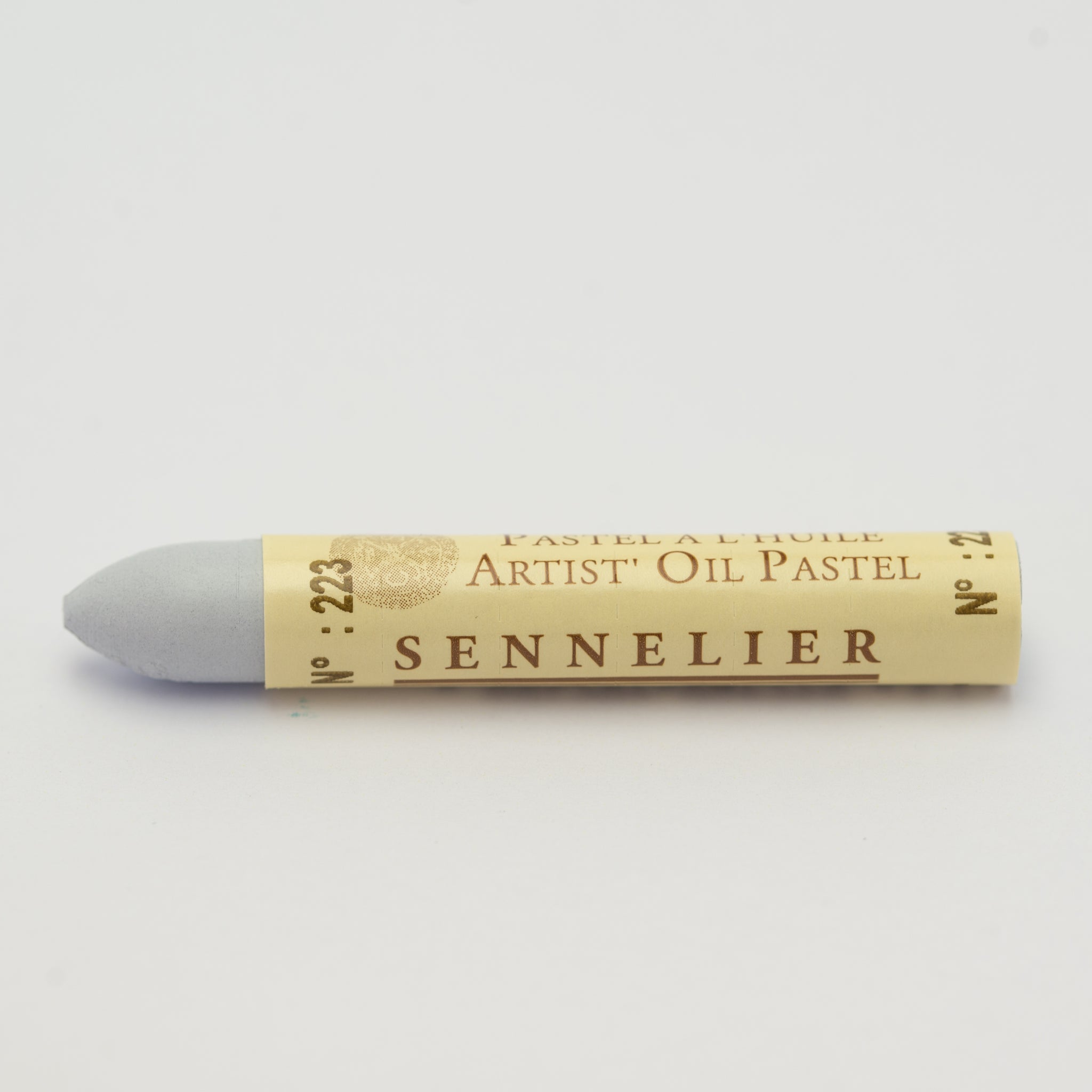 A single Sennelier oil pastel crayon against a white background, displaying the brand name and the words 'Artist Oil Pastel' on the wrapper.
