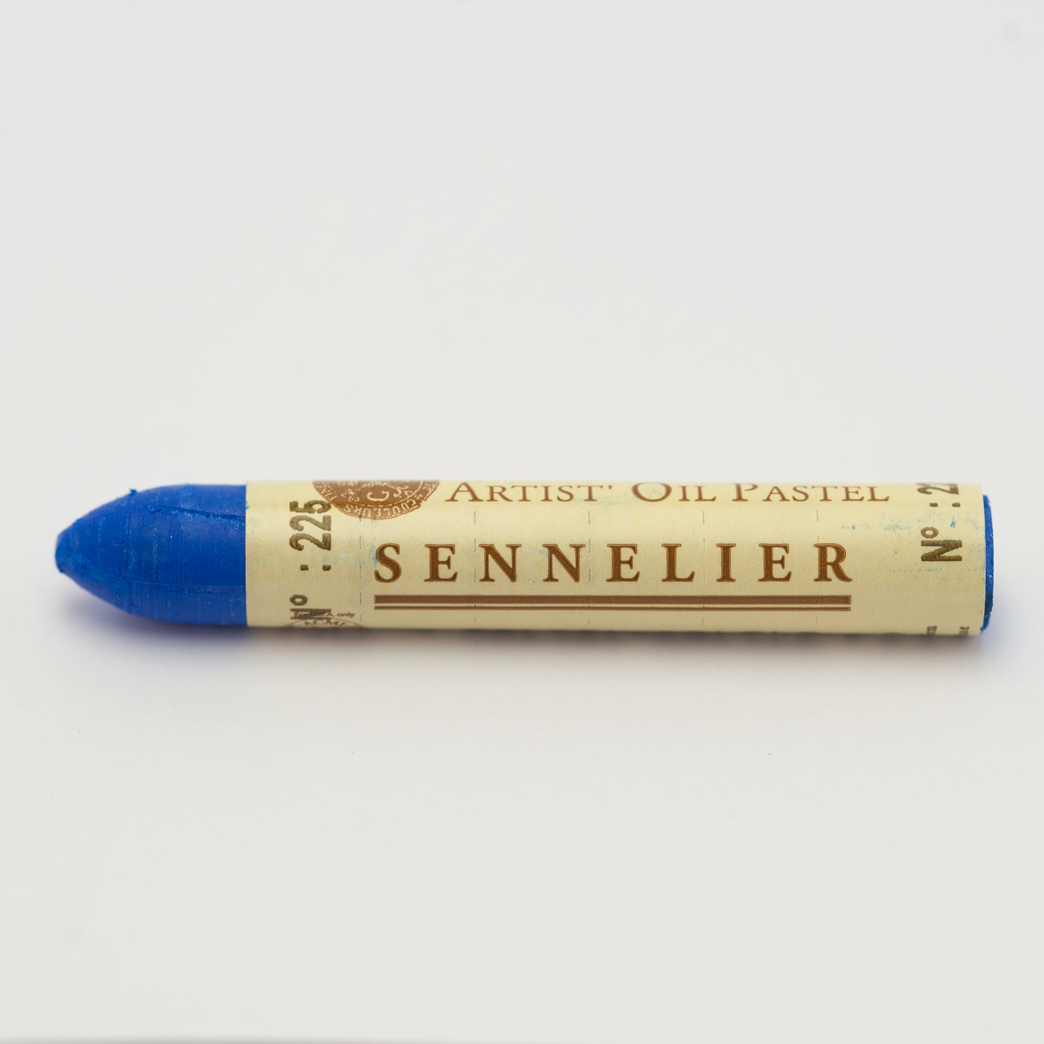 A single Sennelier oil pastel crayon against a white background, displaying the brand name and the words 'Artist Oil Pastel' on the wrapper.