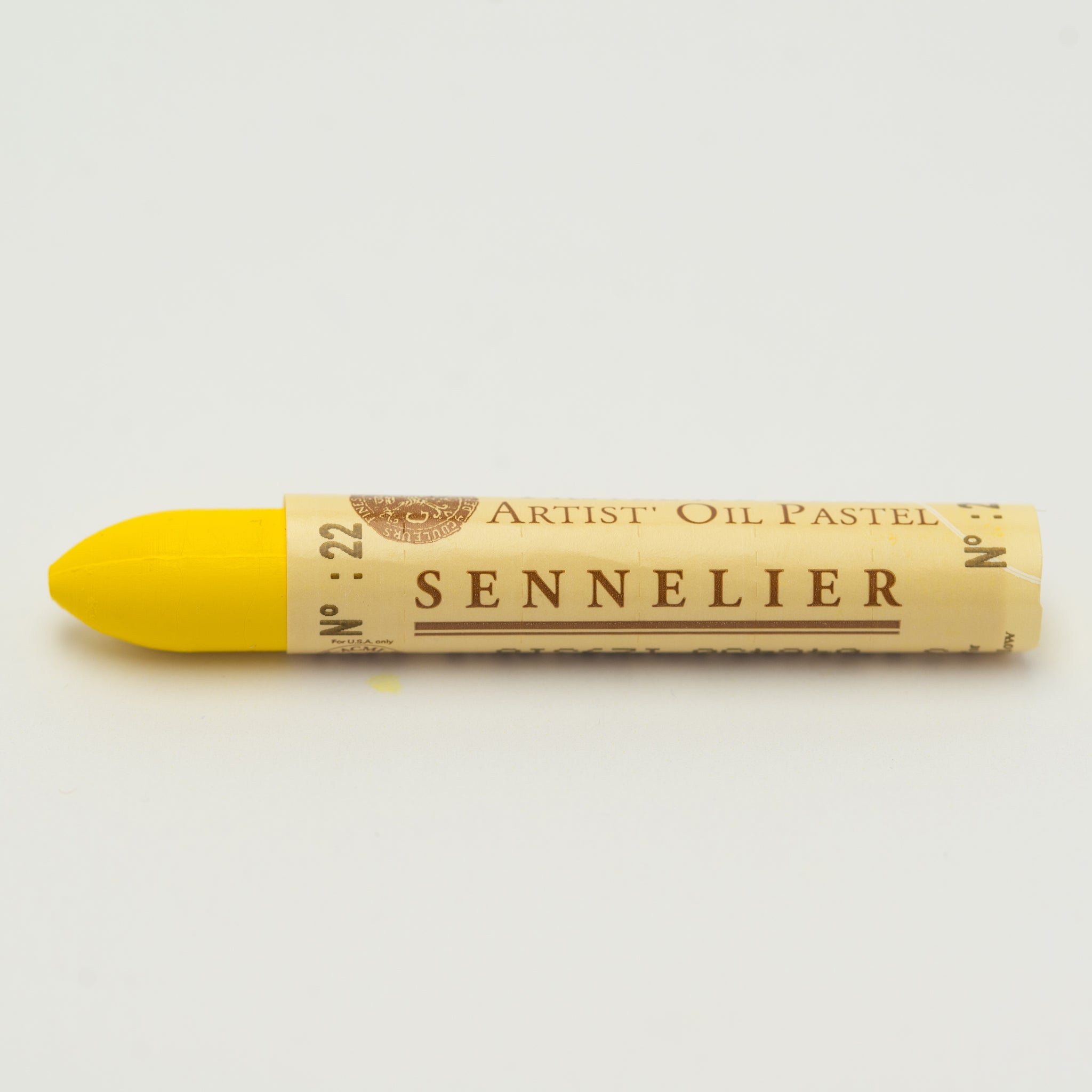 A single Sennelier oil pastel crayon against a white background, displaying the brand name and the words 'Artist Oil Pastel' on the wrapper.