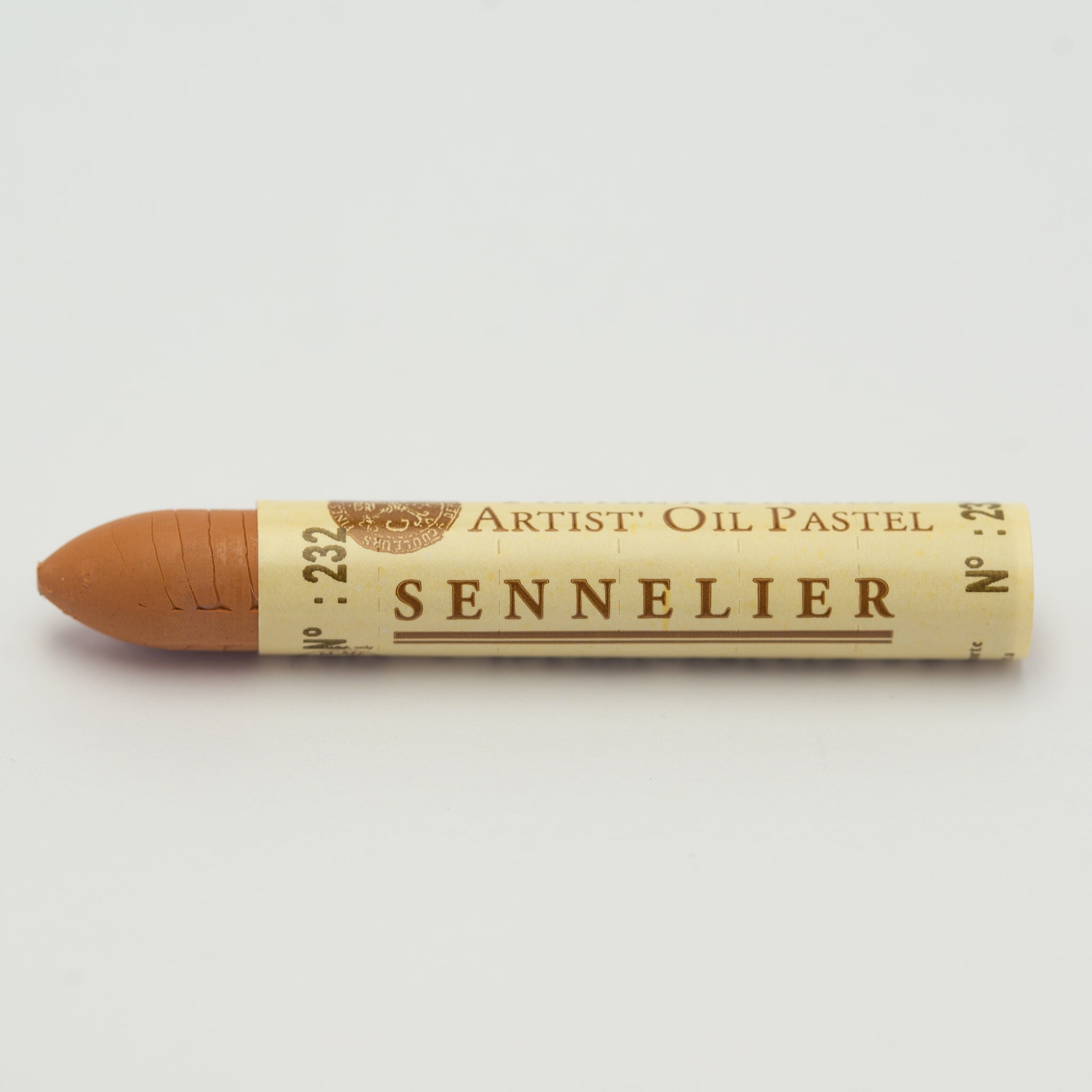 A single Sennelier oil pastel crayon against a white background, displaying the brand name and the words 'Artist Oil Pastel' on the wrapper.