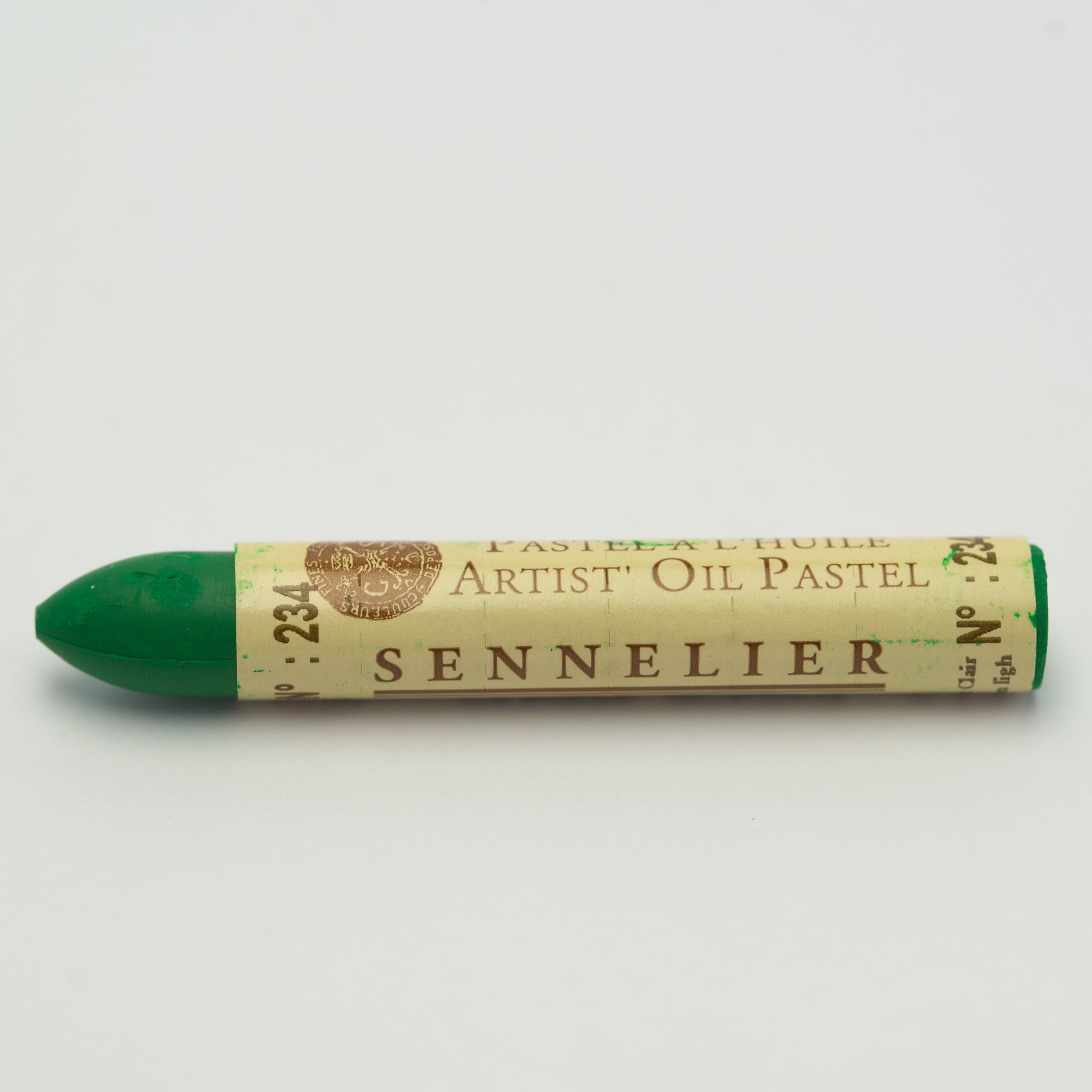 A single Sennelier oil pastel crayon against a white background, displaying the brand name and the words 'Artist Oil Pastel' on the wrapper.