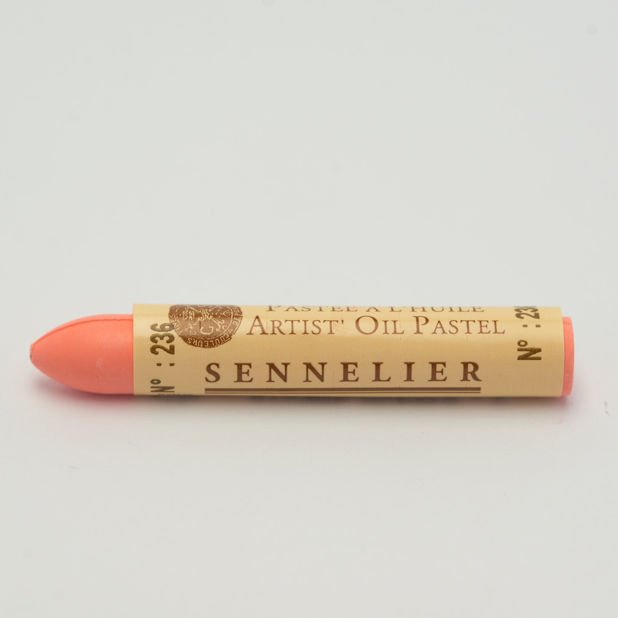 A single Sennelier oil pastel crayon against a white background, displaying the brand name and the words 'Artist Oil Pastel' on the wrapper.
