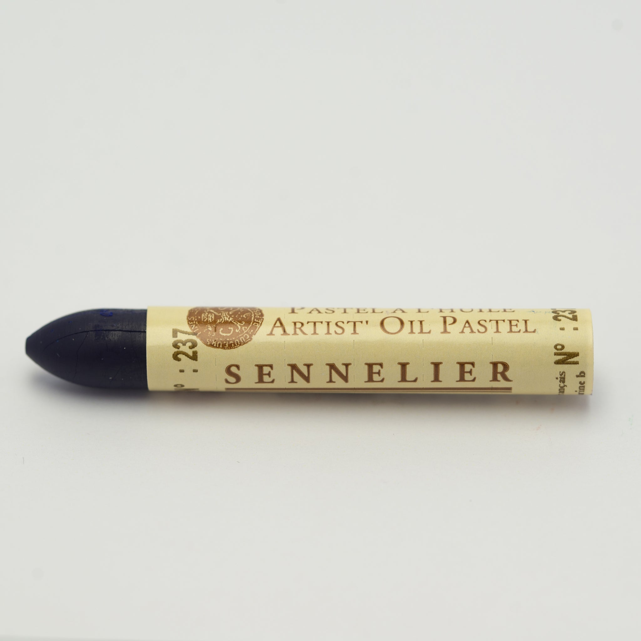 A single Sennelier oil pastel crayon against a white background, displaying the brand name and the words 'Artist Oil Pastel' on the wrapper.