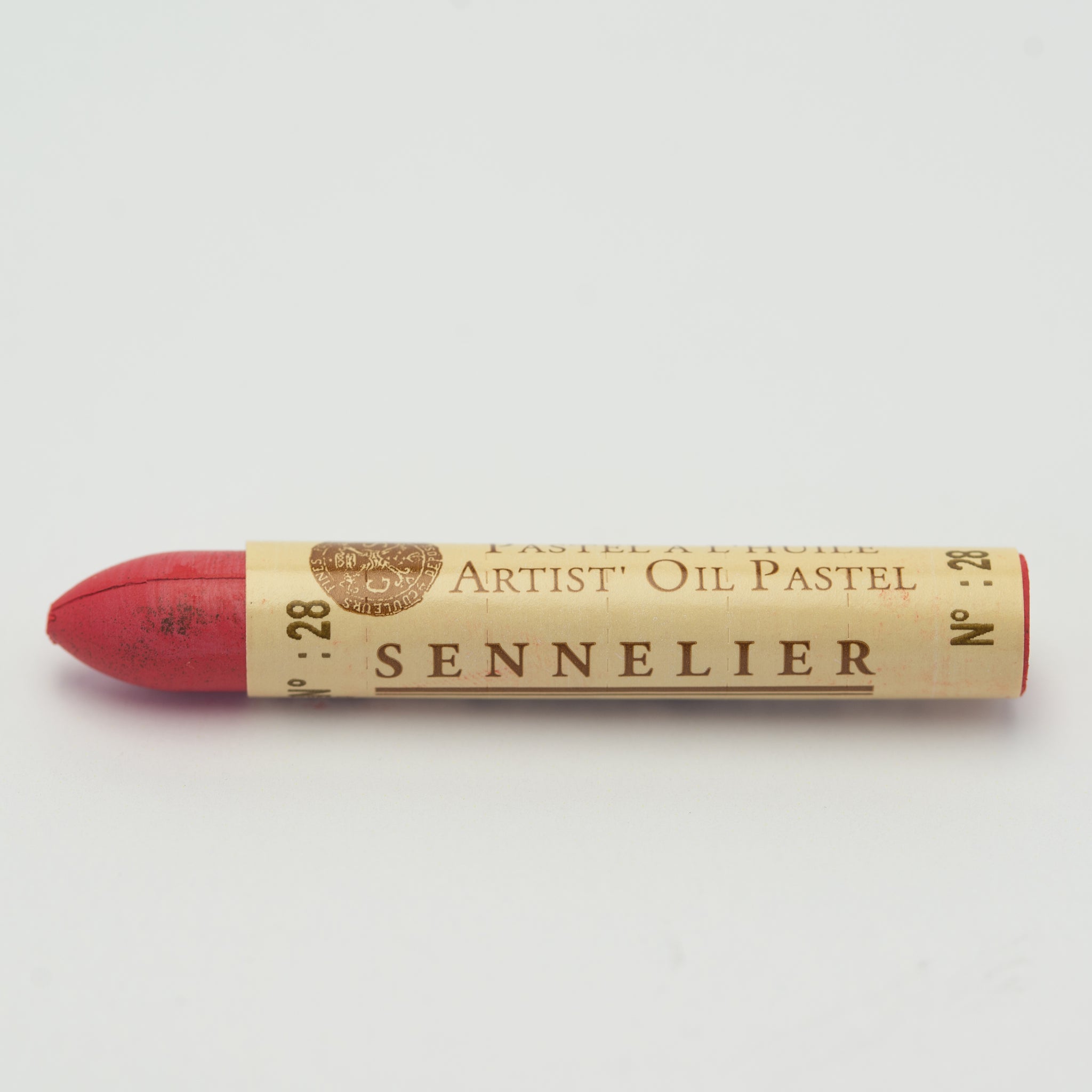 A single Sennelier oil pastel crayon against a white background, displaying the brand name and the words 'Artist Oil Pastel' on the wrapper.