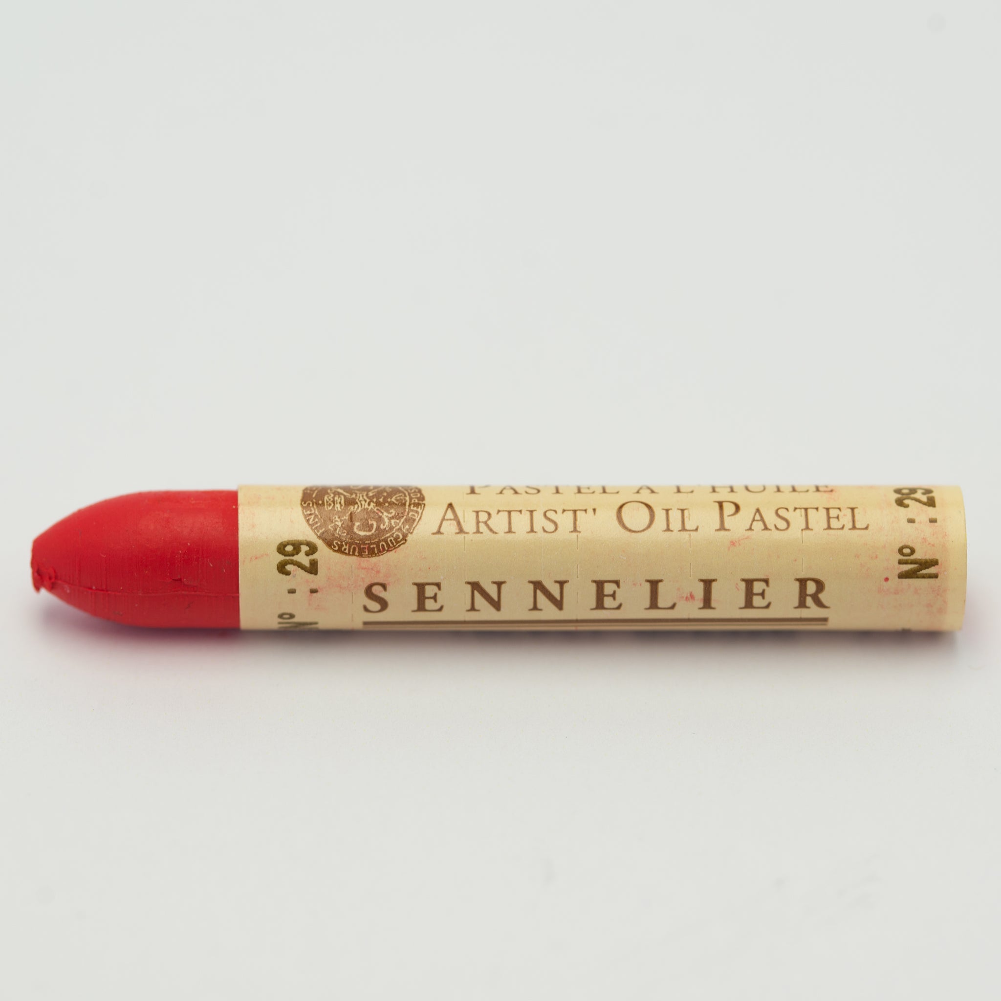 A single Sennelier oil pastel crayon against a white background, displaying the brand name and the words 'Artist Oil Pastel' on the wrapper.