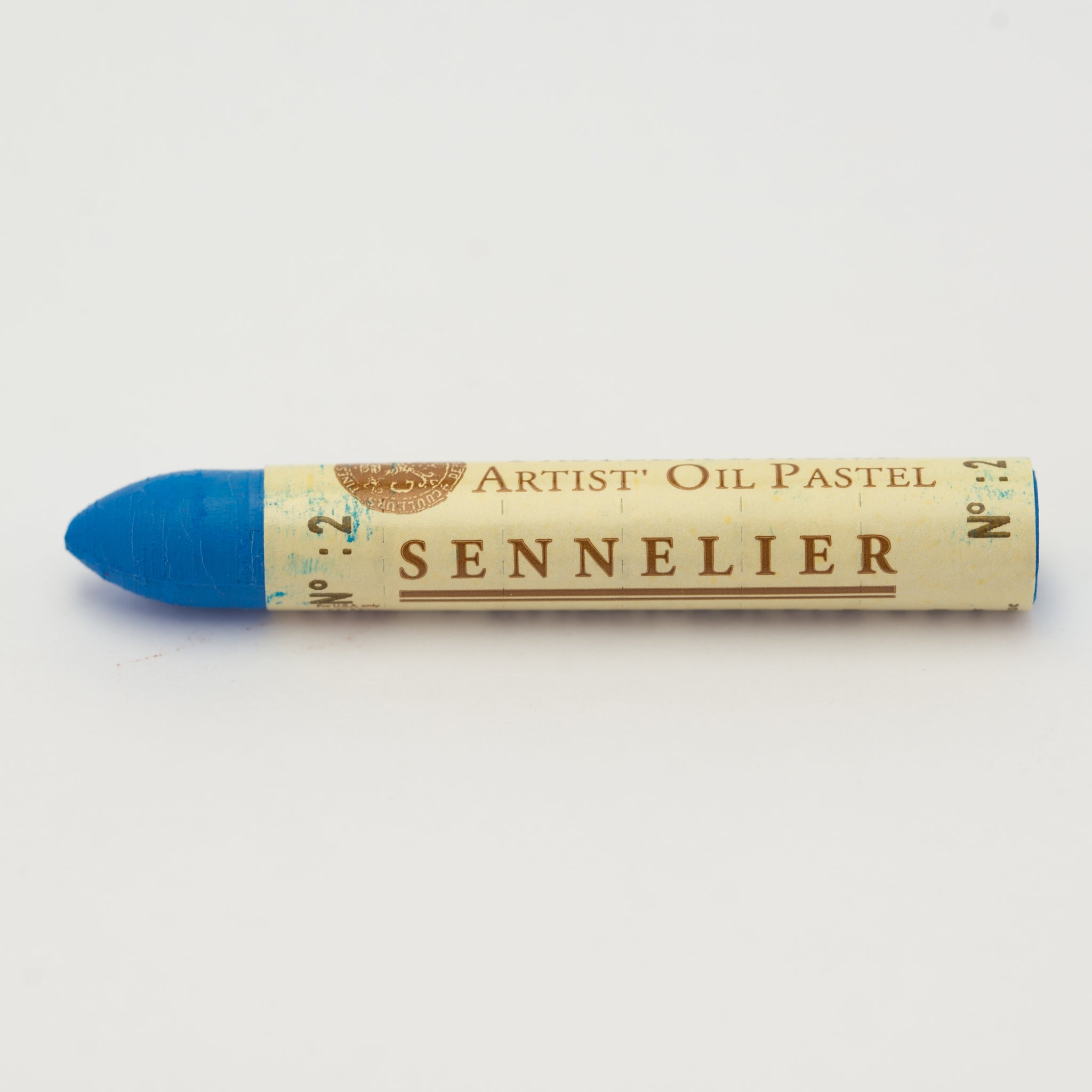 A single Sennelier oil pastel crayon against a white background, displaying the brand name and the words 'Artist Oil Pastel' on the wrapper.