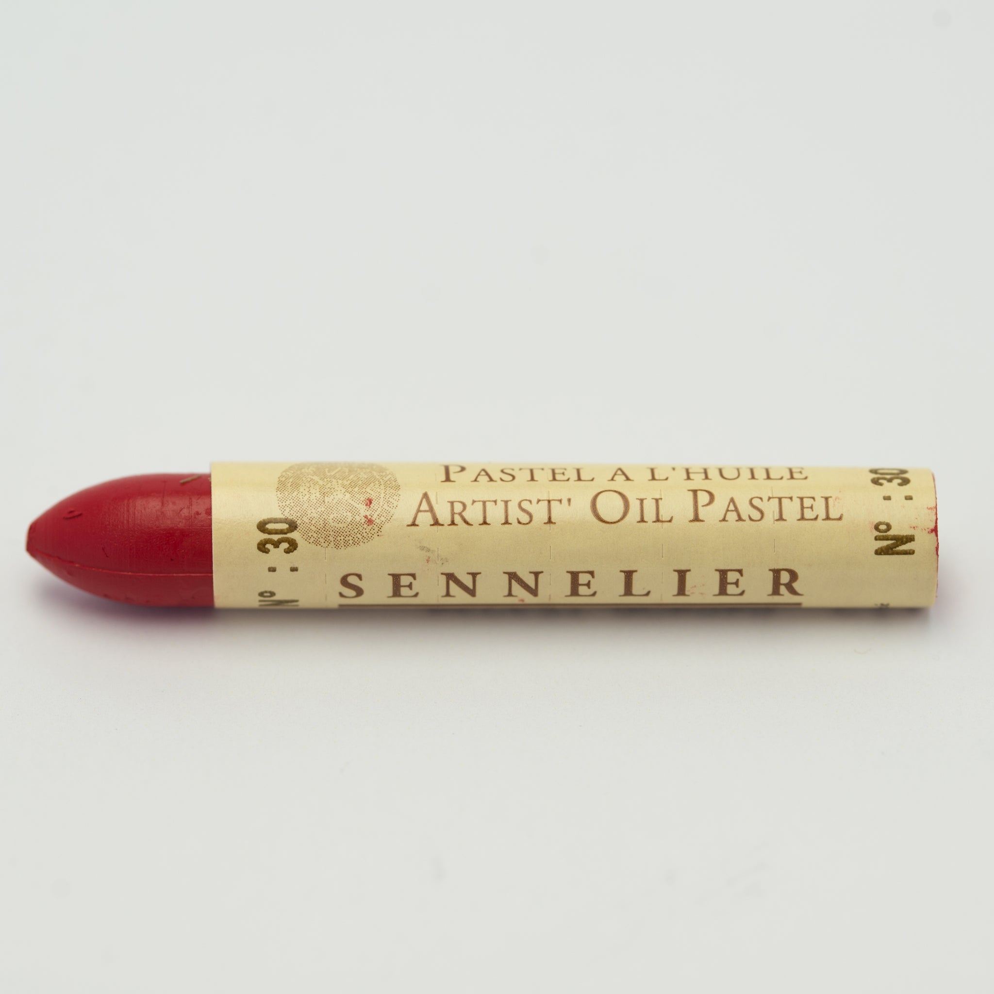 A single Sennelier oil pastel crayon against a white background, displaying the brand name and the words 'Artist Oil Pastel' on the wrapper.