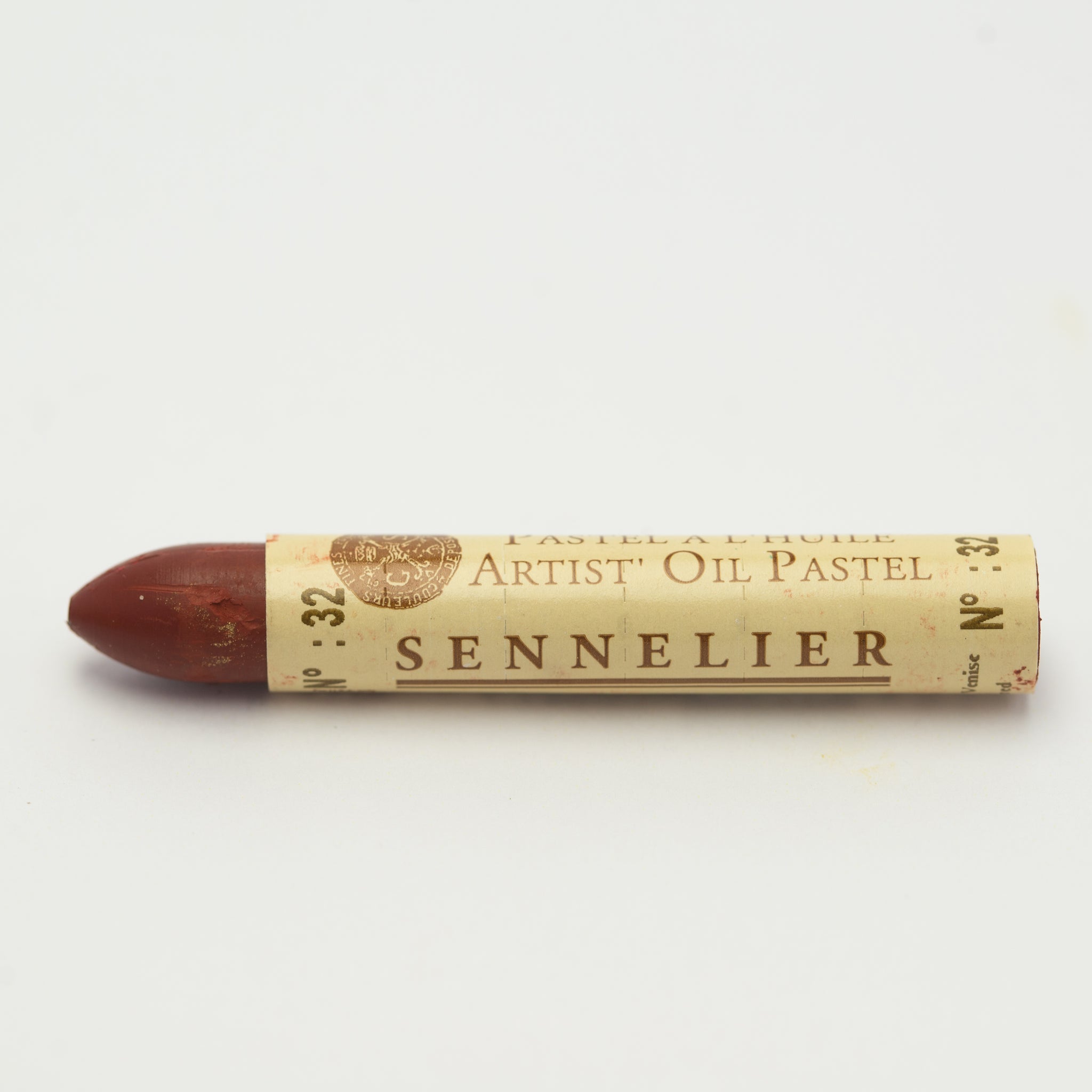 A single Sennelier oil pastel crayon against a white background, displaying the brand name and the words 'Artist Oil Pastel' on the wrapper.