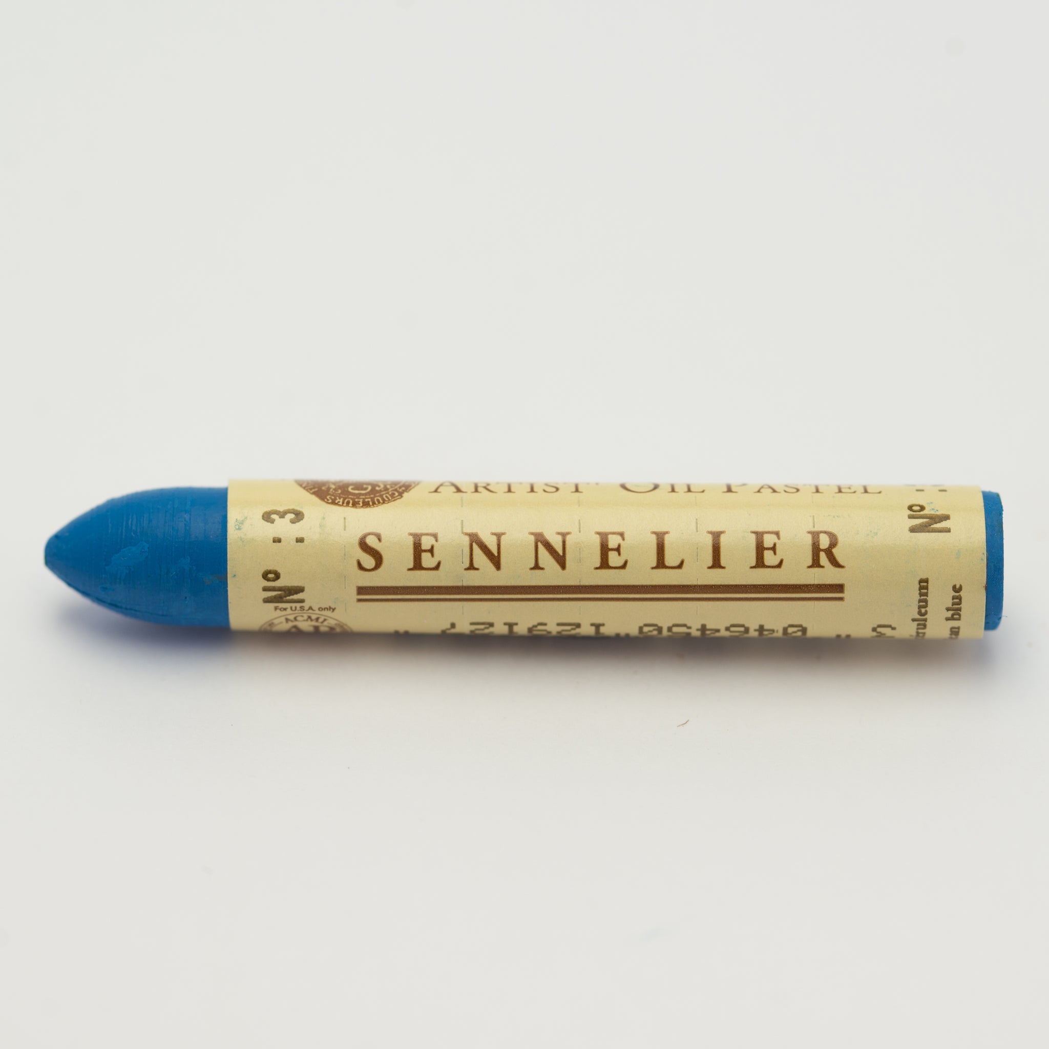 A single Sennelier oil pastel crayon against a white background, displaying the brand name and the words 'Artist Oil Pastel' on the wrapper.