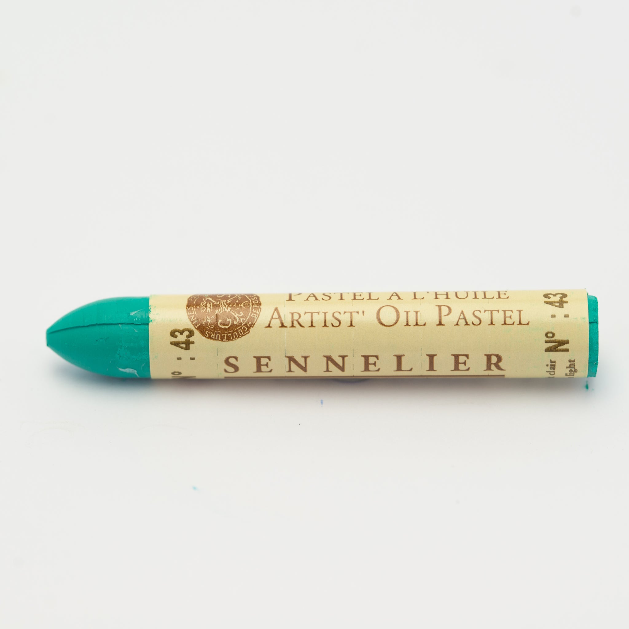 A single Sennelier oil pastel crayon against a white background, displaying the brand name and the words 'Artist Oil Pastel' on the wrapper.
