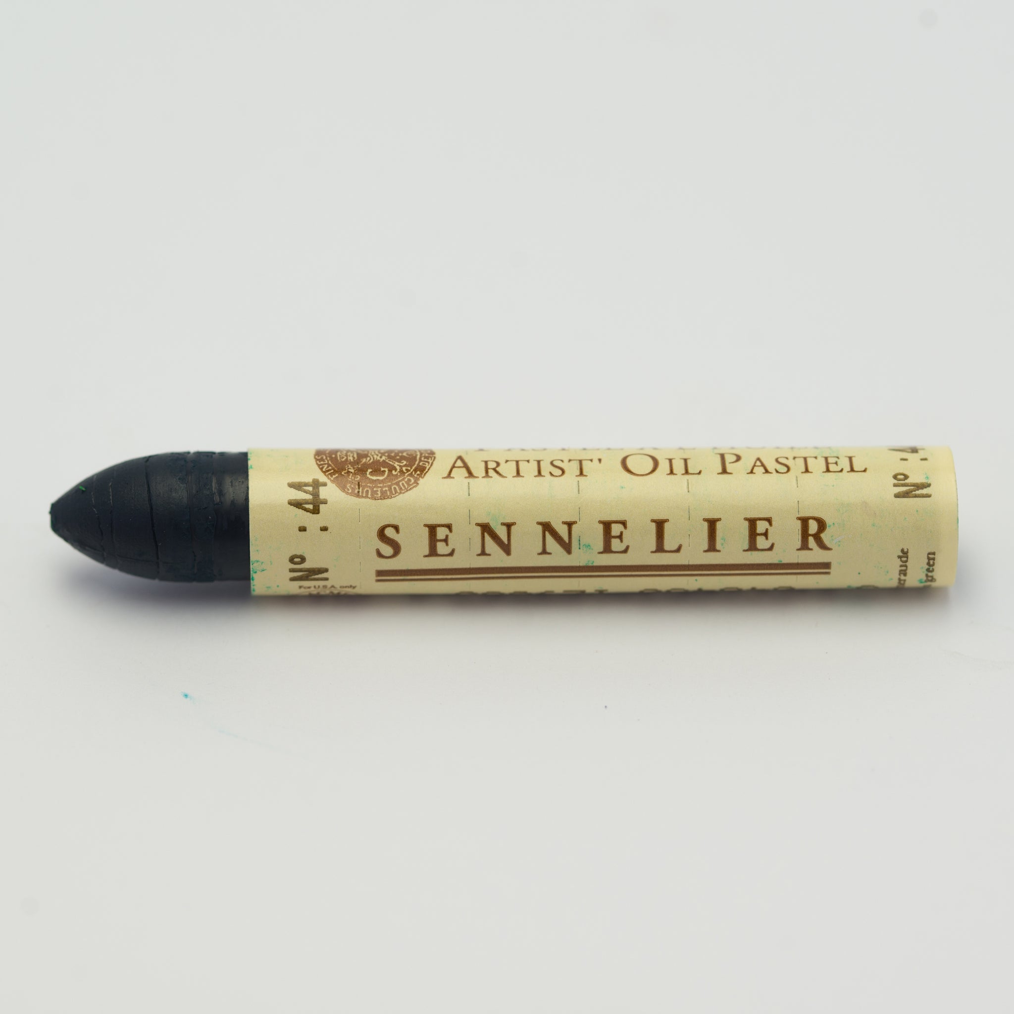 A single Sennelier oil pastel crayon against a white background, displaying the brand name and the words 'Artist Oil Pastel' on the wrapper.
