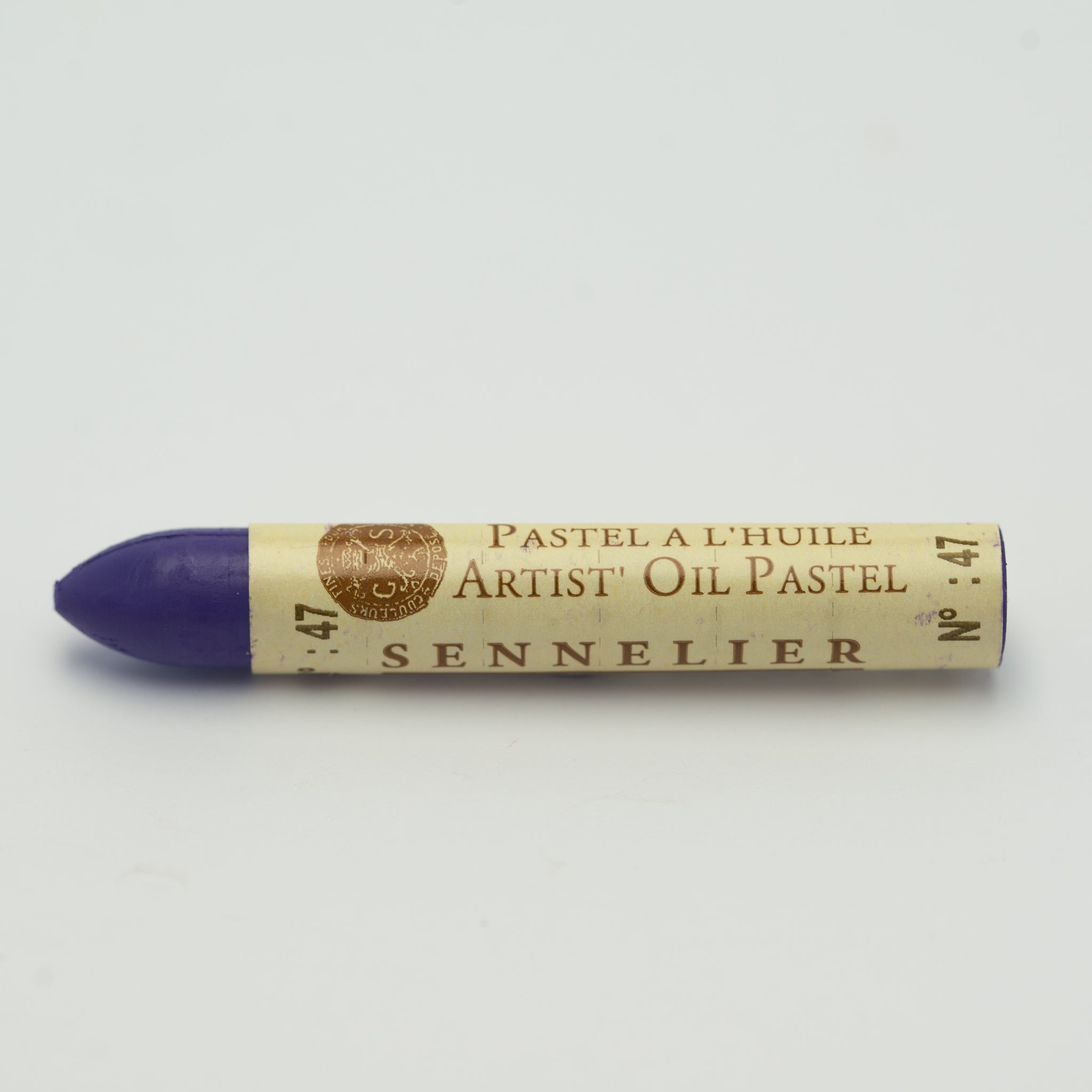 A single Sennelier oil pastel crayon against a white background, displaying the brand name and the words 'Artist Oil Pastel' on the wrapper.