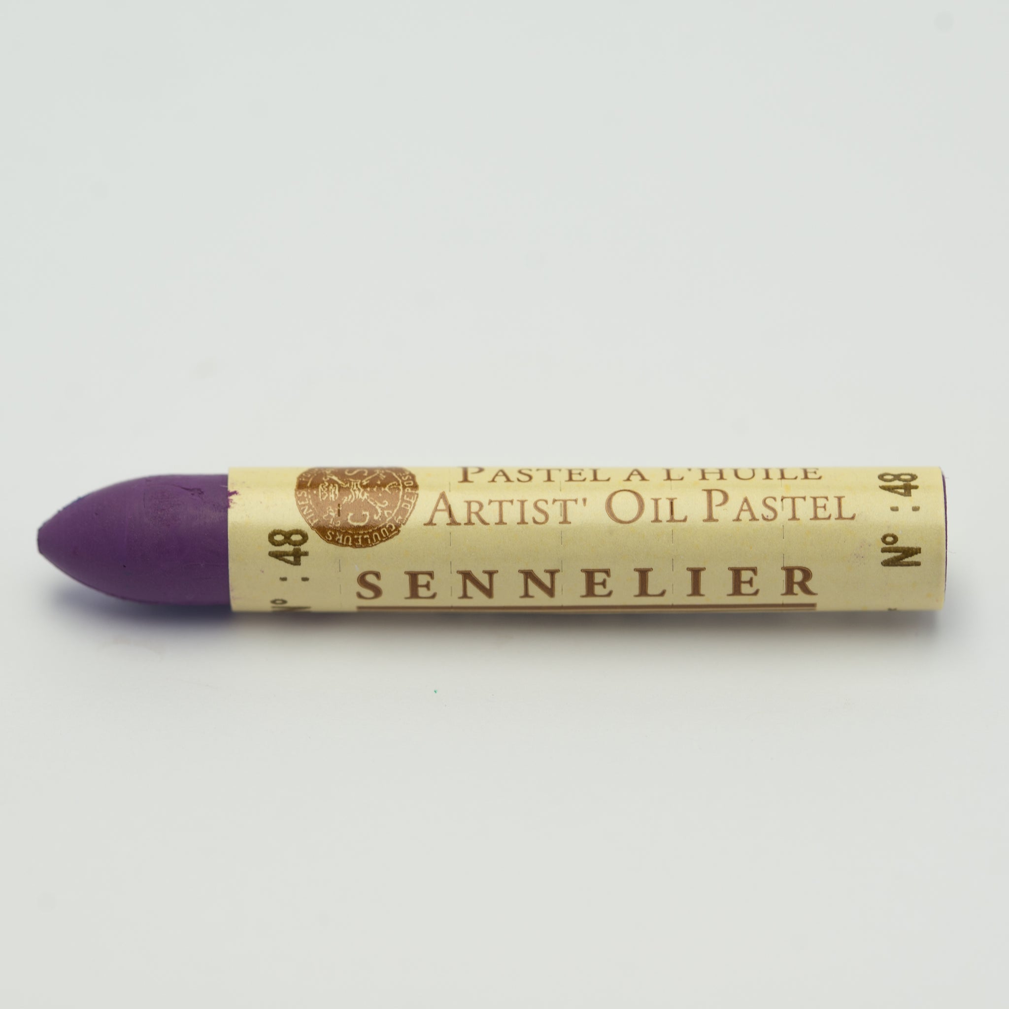 A single Sennelier oil pastel crayon against a white background, displaying the brand name and the words 'Artist Oil Pastel' on the wrapper.