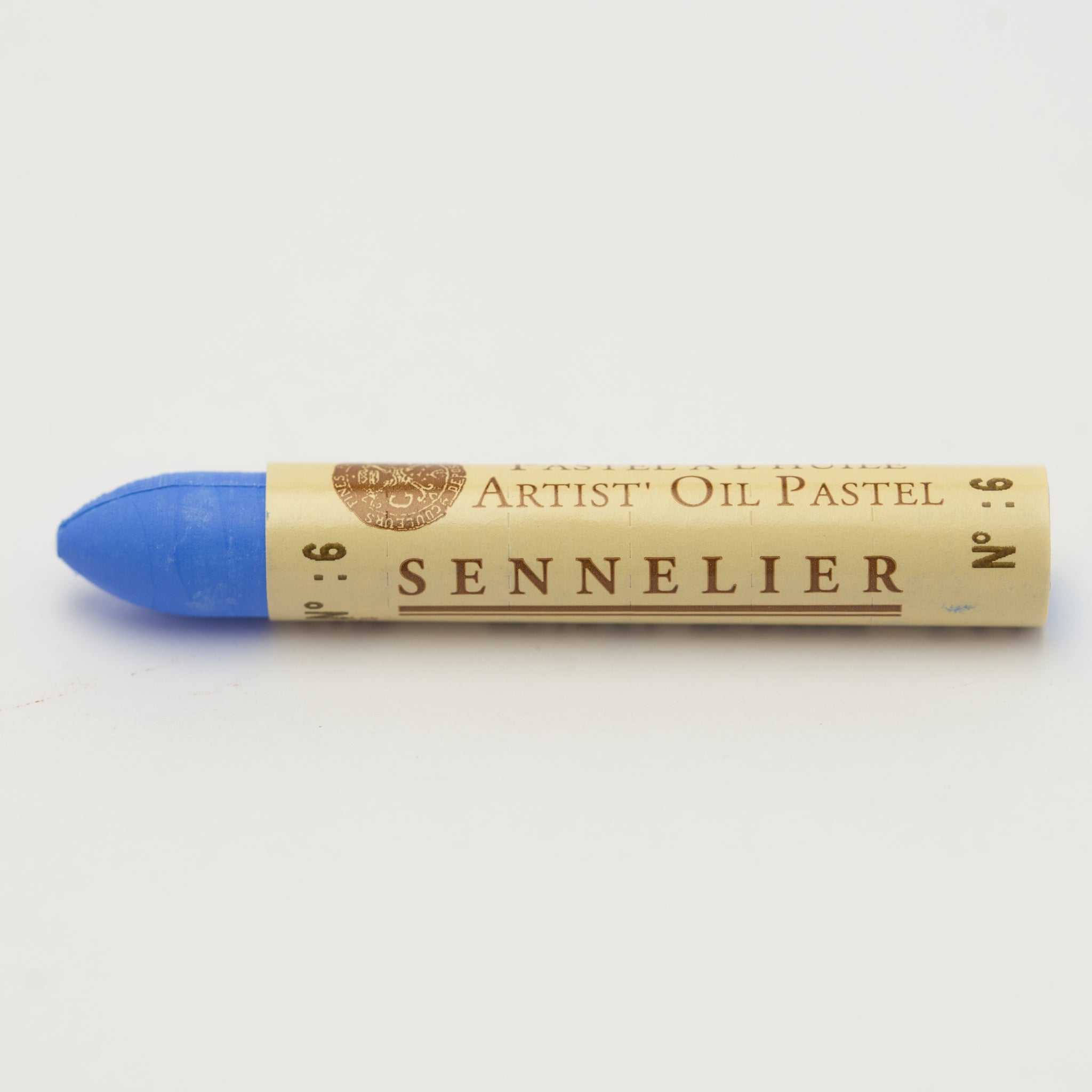 A single Sennelier oil pastel crayon against a white background, displaying the brand name and the words 'Artist Oil Pastel' on the wrapper.