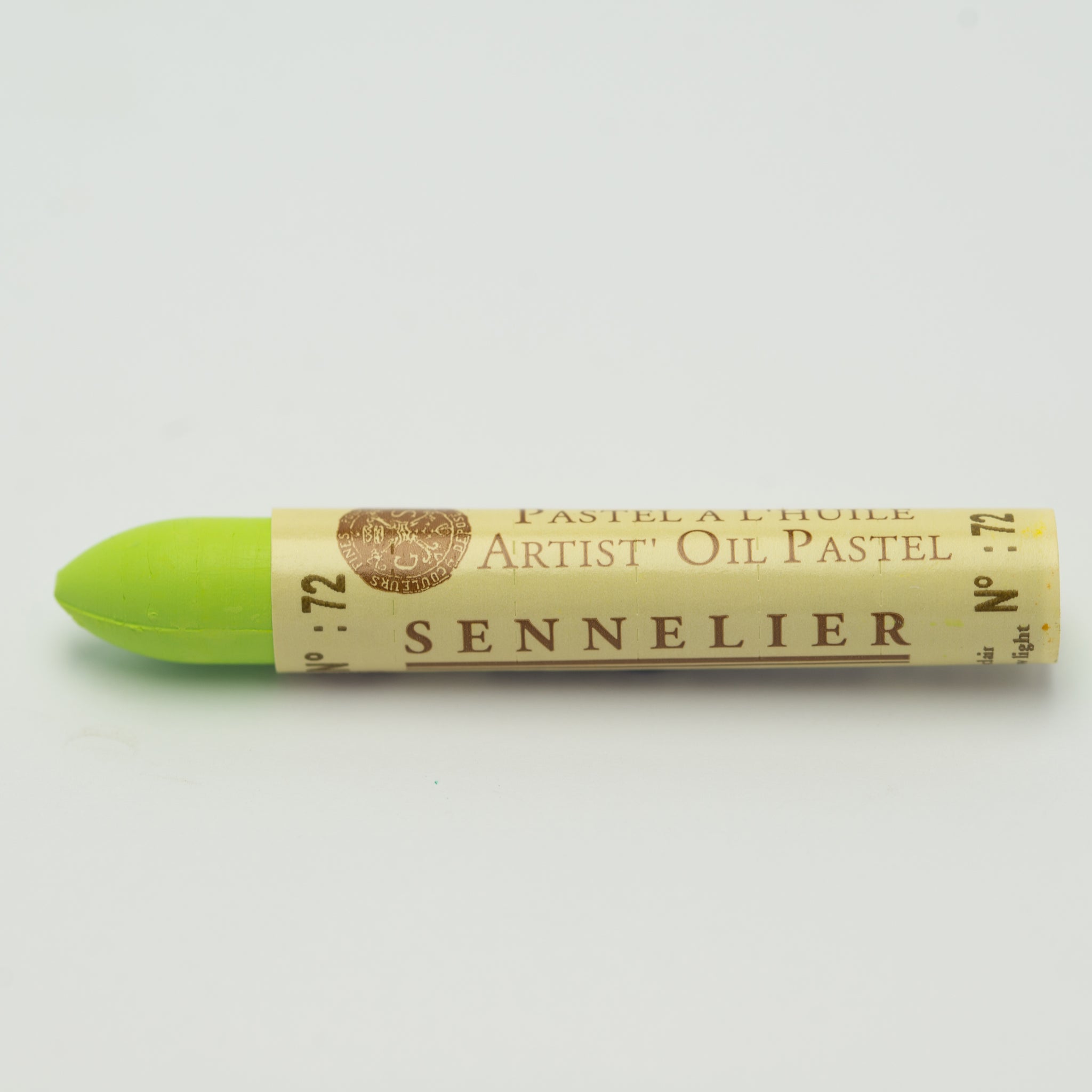 A single Sennelier oil pastel crayon against a white background, displaying the brand name and the words 'Artist Oil Pastel' on the wrapper.