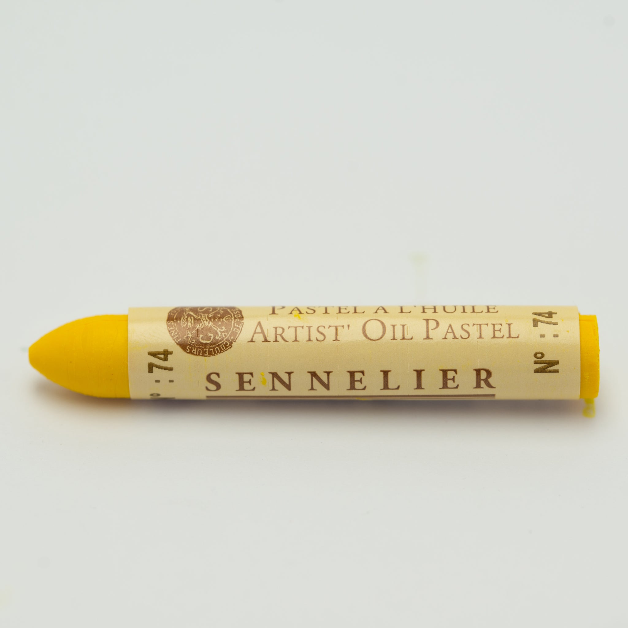 A single Sennelier oil pastel crayon against a white background, displaying the brand name and the words 'Artist Oil Pastel' on the wrapper.