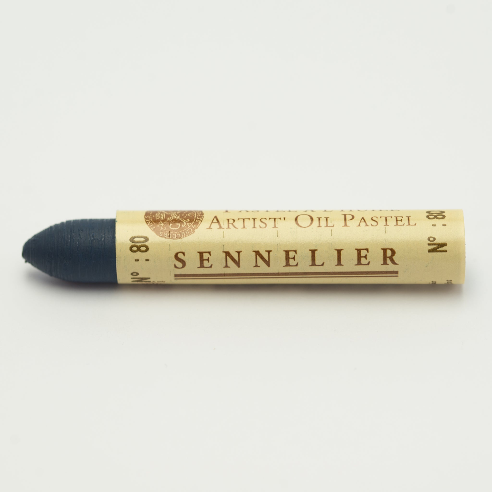 A single Sennelier oil pastel crayon against a white background, displaying the brand name and the words 'Artist Oil Pastel' on the wrapper.