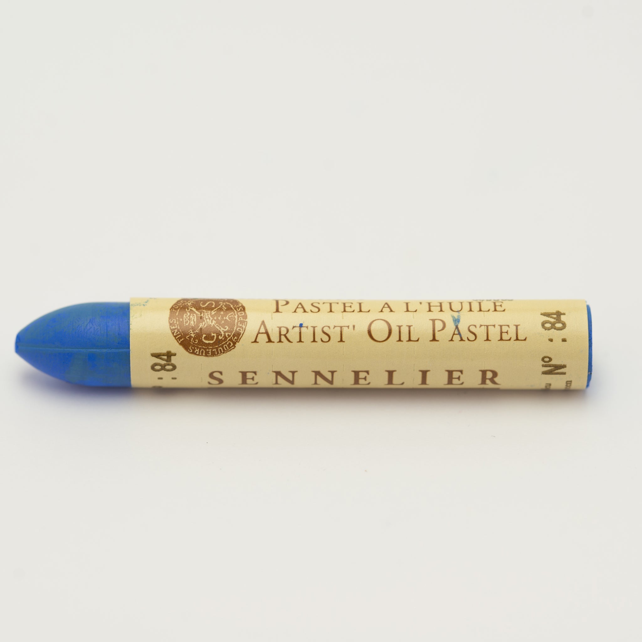 A single Sennelier oil pastel crayon against a white background, displaying the brand name and the words 'Artist Oil Pastel' on the wrapper.
