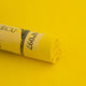 A close-up of a bright yellow Sennelier extra soft pastel. on the same coloured background, with the colour information printed on the paper wrap.