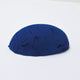 A half egg shaped pastel in a deep cool blue tone, sitting on a white background