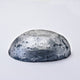 A half egg shaped pastel in a graphite tone, sitting on a white background