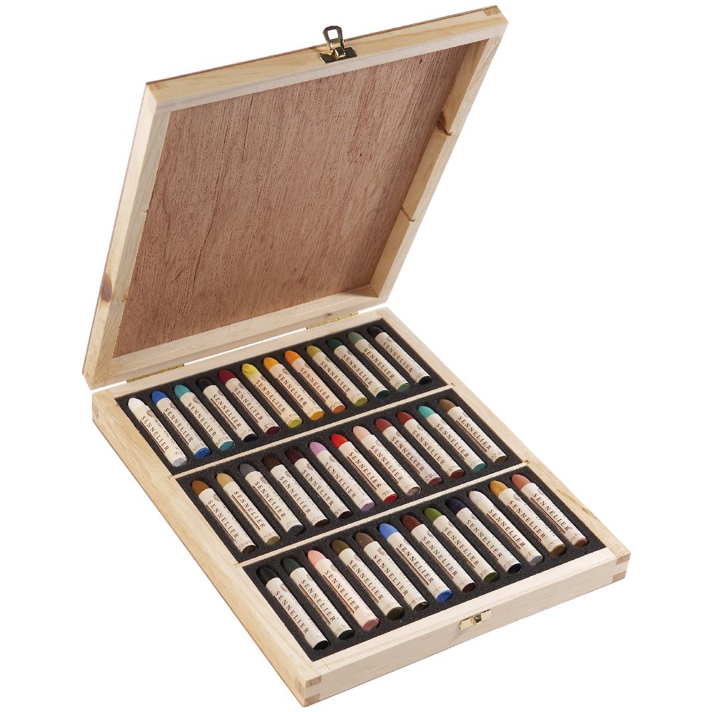 36 oil pastels in various colours displayed in an open wooden box with foam lining 