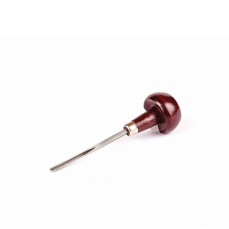 A mushroom wooden handled V-shaped gouge cutter with a steel blade on a white background